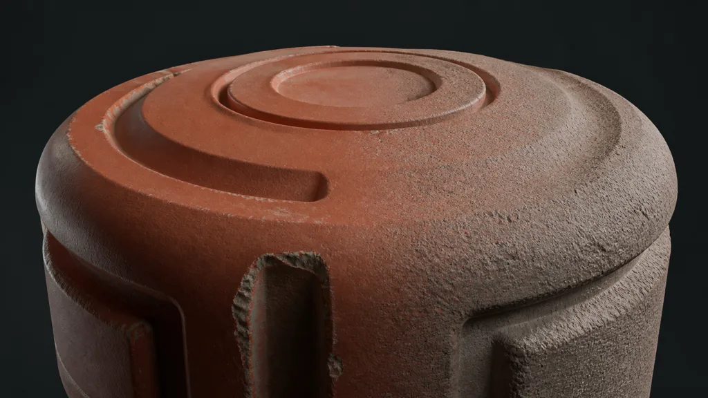 Rounded red coated test object transitioning from smoother paint to exposed fine mineral microstructure